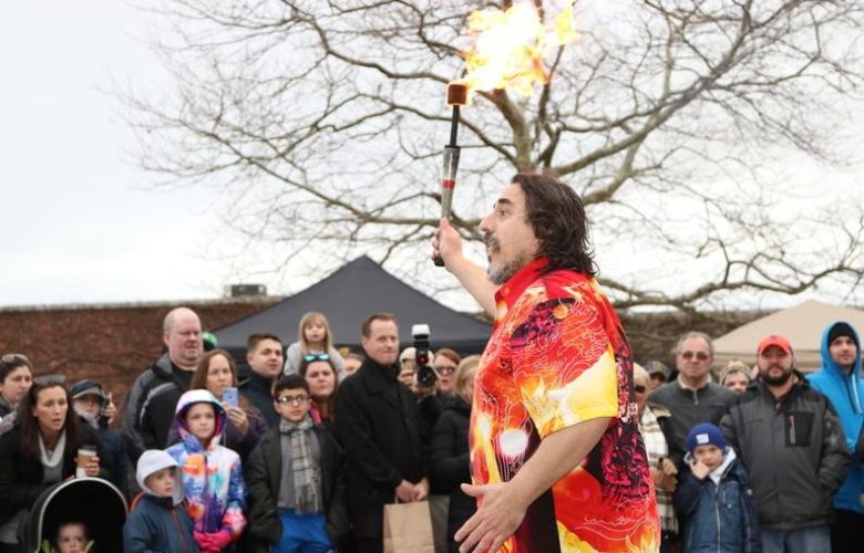 Keith Leaf prepares to juggle fire