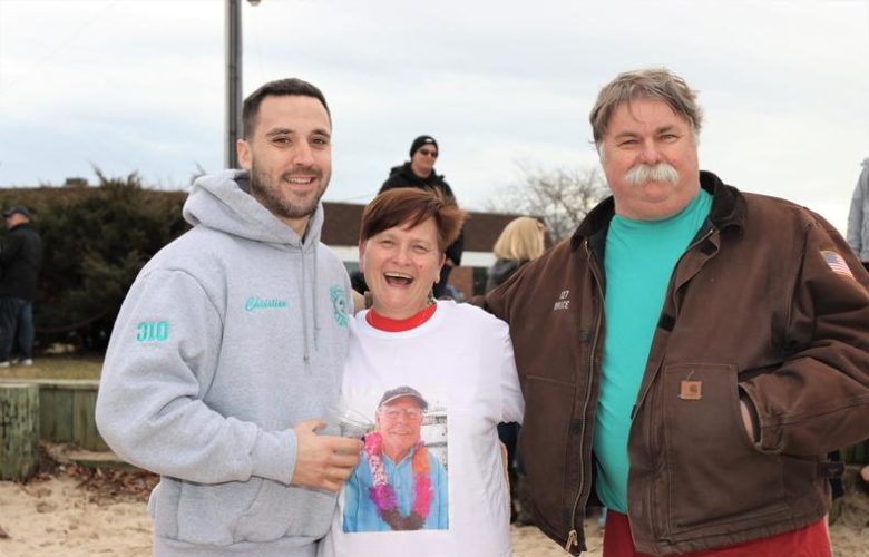 Christian Cooney, Margaret Smyth, Bruce Stafford prepare for the cold waters at the polar plunge