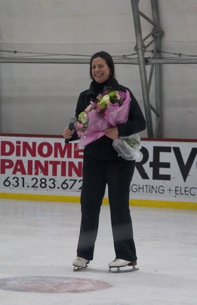 Jessica Kellis receives flowers from her student body