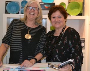 Kathleen Mulcahy, shop manager, having fun with Christina M. Strassfield, Director/Chief Curator