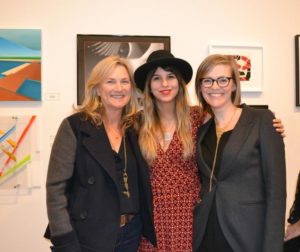 Artists Valley Bak and Darlene Charneco admiring the exhibit with Guild Hall organizer/Curatorial Assistant Casey Dalene