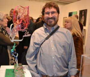 Artist member Alan Glasser shows off his 'Big Heart Balloon' sculpture
