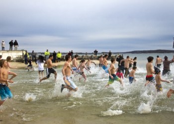 Dozens of East Enders took the plunge into the frigid waters of Founder's Landing in Southold on Saturday to raise money for Maureen's Haven.