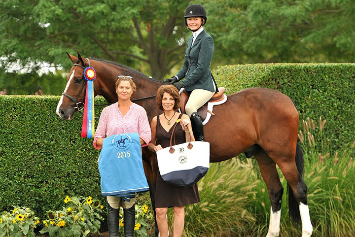 Chloe Hase (mounted) and Brando were Co-Grand Local Hunter Champions at the 40th annual Hampton Classic.