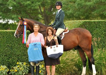 Chloe Hase (mounted) and Brando were Co-Grand Local Hunter Champions at the 40th annual Hampton Classic.