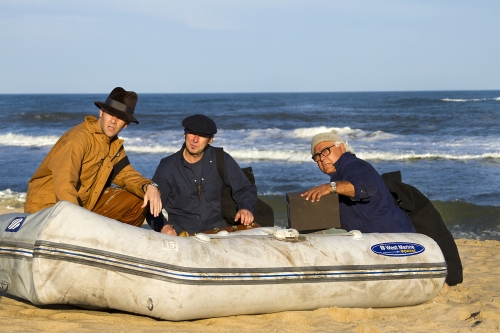 Nazi saboteurs George Dasch (Carl Irace), Peter Burger (Even Thomas), and Heinrich Heinck (Dominic Stanzione) unload explosives and supplies from the grounded u-boat.