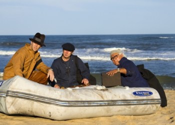 Nazi saboteurs George Dasch (Carl Irace), Peter Burger (Even Thomas), and Heinrich Heinck (Dominic Stanzione) unload explosives and supplies from the grounded u-boat.
