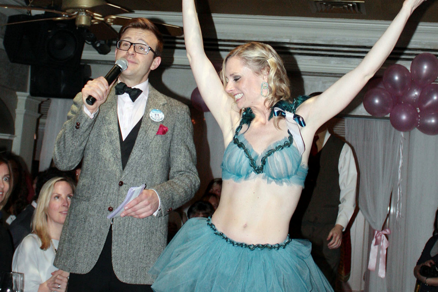 Auctioneer Lucas Hunt and model Mary Sabo, wearing "Phoenix” by artist Yuka Silvera, at the 2013 Reconstructed Bra Fashion Show & Auction. Photo credit: Tom Kochie