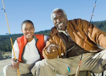 Smiling Grandfather and Grandson Fishing