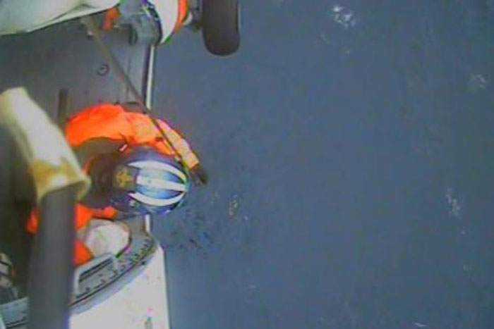 Despite winds gusting to 25-knots and seas reaching nine-feet, the Jayhawk helicopter crew safely hoisted the man aboard and transported him to Air Station Cape Cod where emergency medical services awaited his arrival. (Coast Guard Video by Air Station Cape Cod)