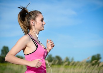 fitness sport healthy and cheerful young woman running outdoor
