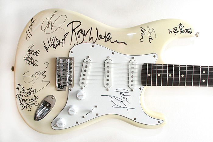AFTEE guitar with autographs from Roger Waters, Sting, Adam Lambert, Nile Rodgers, Avicii and more