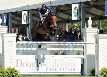 Molly Ashe-Cawley rode Carissimo to victory in the $50,000 Douglas Elliman Grand Prix Qualifier, presented by Longines at the Hampton Classic