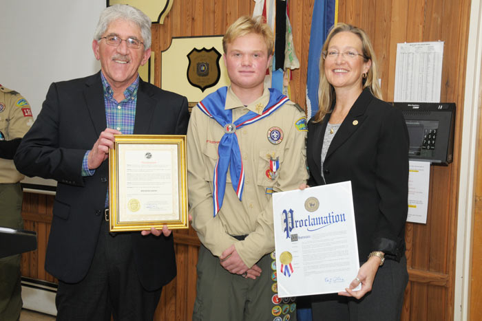 East Hampton Town Supervisor Larry Cantwell, Eagle Scout Brendan Snow, Suffolk County Legislator Bridget Fleming.