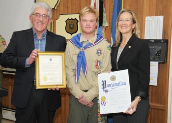 East Hampton Town Supervisor Larry Cantwell, Eagle Scout Brendan Snow, Suffolk County Legislator Bridget Fleming.