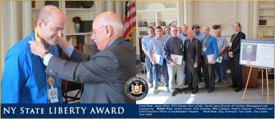 Senator Kenneth P. LaValle with NY State Liberty Award recipient, David Lopez and the team that kept Southampton Hospital up and running during and after Hurricane Sandy. Front Row: James White, NYS Senator Ken LaValle, David Lopez,Director of Facilities Management and Engineering Middle Row: Jordan Gomez, Rich Donohue, Mike Catalano, Robert Chaloner -- President and Chief Executive Officer of Southampton Hospital Back Row: Gary Scherpich, Tom Goetz, Tom Lawlor, Tom Colitti.