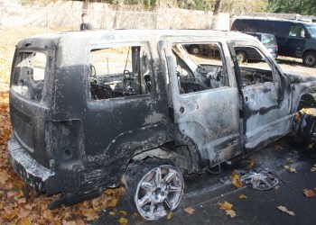Police say burglars stole and burned this Jeep Liberty.