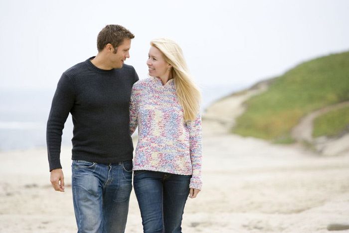 Couple walking on the beach