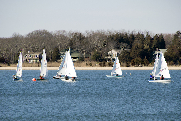 Boats from the Breakwater Yacht Club dotted the bright blue icy water beyond the wharf of HarborFrost 2016
