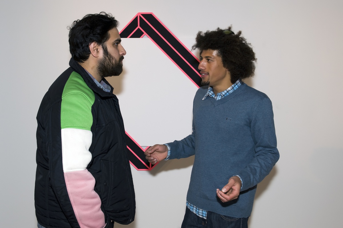 Brooklyn artist Aakash Nihalani, with Gallery owner Tripoli Patterson talking in front of one of Nihalani's pieces