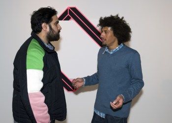 Brooklyn artist Aakash Nihalani, with Gallery owner Tripoli Patterson talking in front of one of Nihalani's pieces