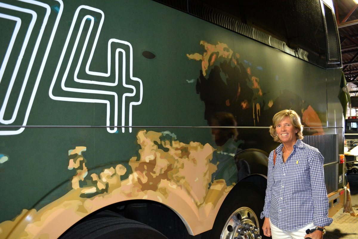 Lynn Mara in front of her winning Hampton Jitney wrap design.