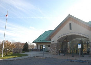 A fan takes a selfie with the Kardashian sisters on Main Street in Southampton Village.