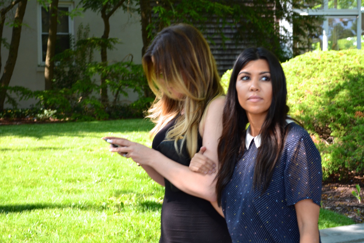 Khloé and Kourtney Kardashian walk down Jobs Lane in Southampton Village.