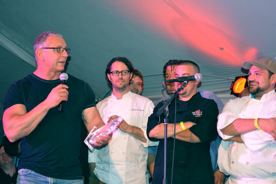 At the 2014 Dan's GrillHampton, host Robert Irvine of "Restaurant Impossible" announces the winner of the grill competition.