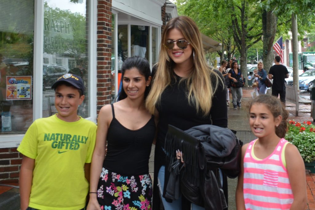 Khloé Kardashian poses with fans.