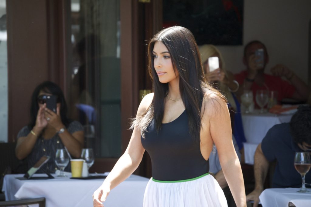 Kim Kardashian leaves 75 Main after dining with sister Kourtney.