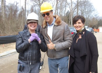 Frederick Eklund gives the thumbs up, flanked by a 