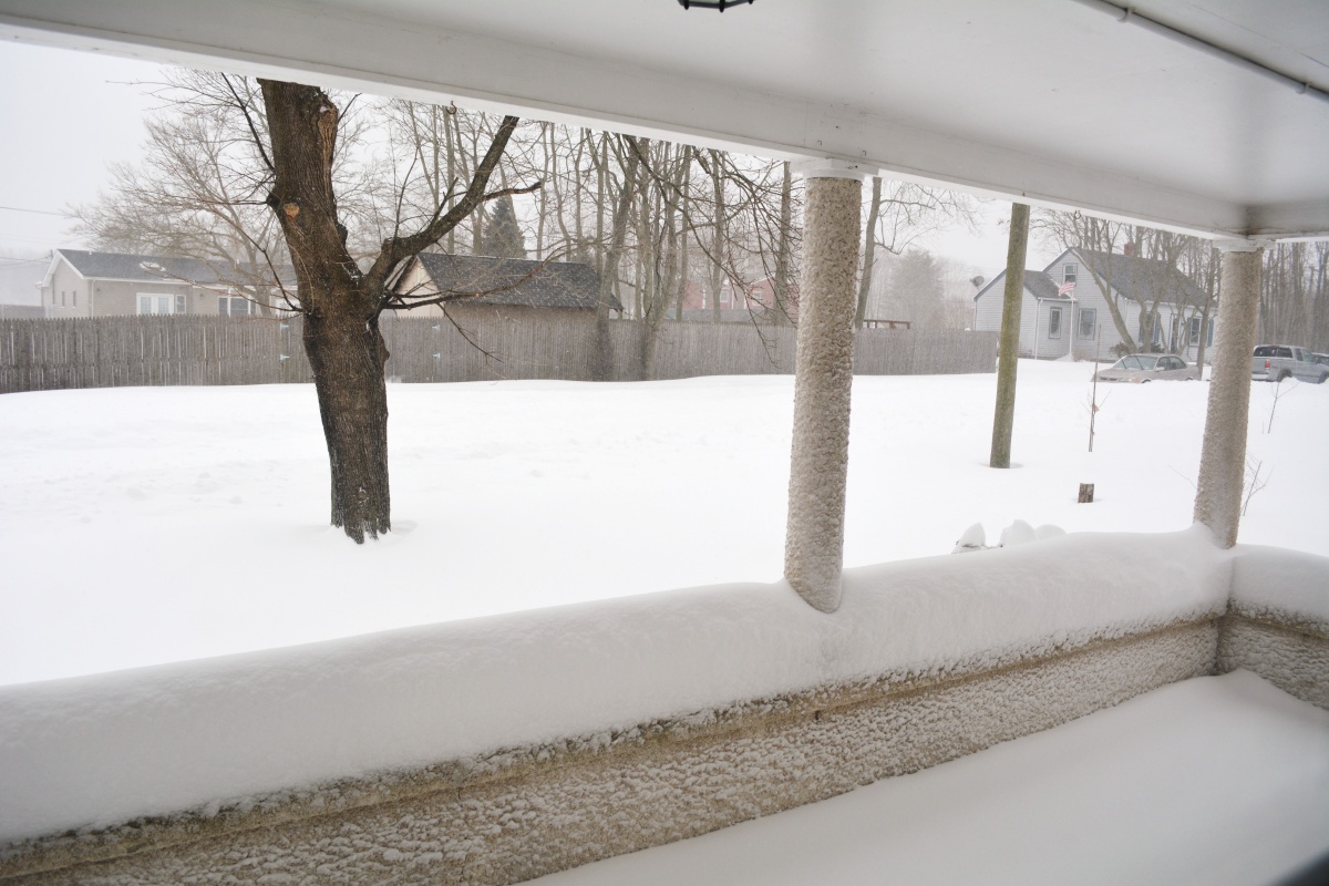 Snow blankets the East End Tuesday morning, and keeps falling.