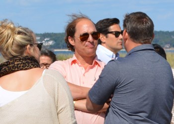 Matthew McConaughey at the Jimmy Aery Way parking lot off Meadow Lane in Southampton Village speaks with Marissa Epley and Southampton Village Mayor Mark Epley.