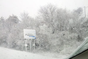 The snow covered Dan's Country sign near Exit 68 on 495 Monday morning
