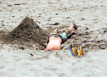 Digging to China is not without its dangers on the beach