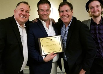 Dan's Hamptons COO Eric Feil, CEO Steve McKenna, Head of Advertising Dan Schock and Assistant Editor David Taylor show off Dan's Papers' John J. Evans Award for Advertising Excellence at the New York Press Association 2017 Better Newspaper Contest