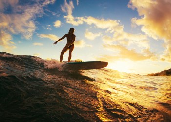 Female surfer sunset