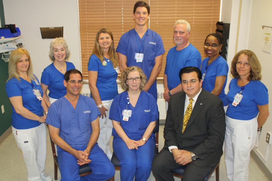 Eleanor Bratter, RN; Geri Karch, RN; Sharon Wicks, RN; Ryan Lovett, CST; Kevin Costello, RN; Sharon Bivins, Endoscopy Technician; and Kathy Goss, RN. (l. to. r, front row) Kristin Naso, DO; Susan Bonn, RN, CGRN, Endoscopy Clinical Coordinator; and Steve Georgopoulos, MD, Chief of Gastroenterology. Missing from photo: Shirley Jones, LPN and Margaret Pugsley, LPN