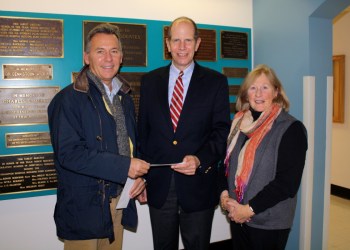 Hampton Designer Showhouse Foundation board member Brian Brady, Southampton Hospital President and CEO Robert S. Chaloner, and Hampton Designer Showhouse Operations Manager Mary Lynch.