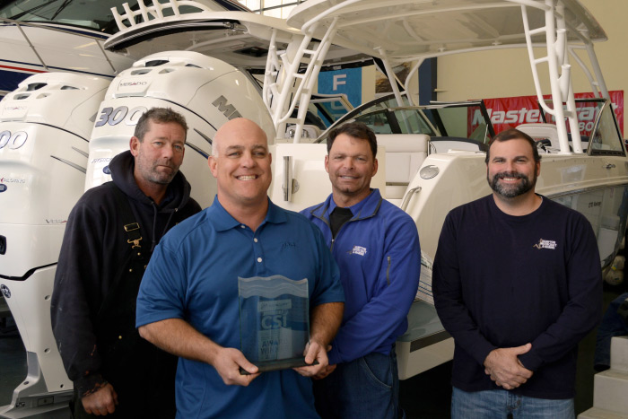 From left to right: Ernie Miller, Head Mechanic; Tony Villareale, President; Mike Friscia, Service Manager; and Mike McSweeney, Service Director