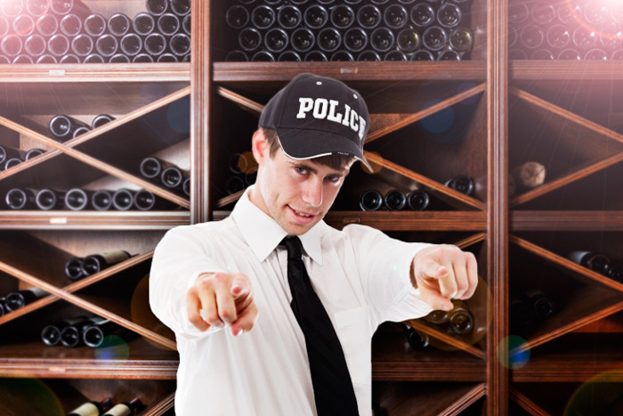 Hamptons Police Financial Officer Larry Laffer shows off the department's new wine cellar