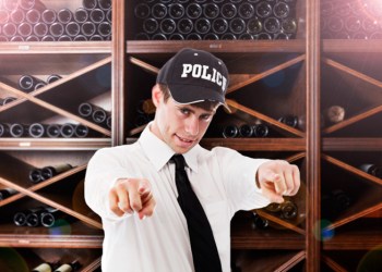 Hamptons Police Financial Officer Larry Laffer shows off the department's new wine cellar