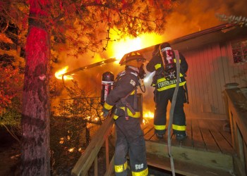 East Hampton firefighters battle a blaze early on October 31. Photo credit: Michael Heller/EHFD