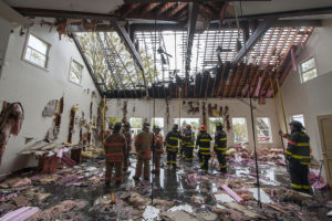 Members of the Southampton, North Sea, Hampton Bays, Bridgehampton, Sag Harbor and East Hampton Fire Departments fight a fire in a vacant building in Water Mill.