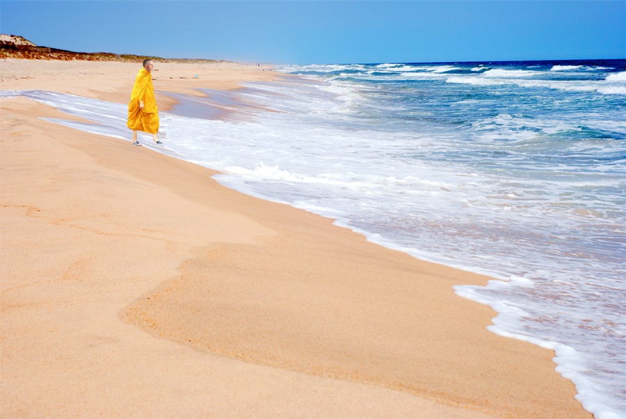 Derwood Hodgegrass wearing robes on the beach