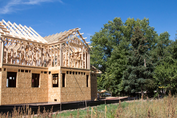 House construction next to trees
