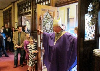 Bishop Nelson Perez opens the main aisle door of Sacred Heart of Jesus & Mary as a Door of Mercy