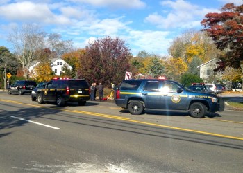 New York State police investigate the accident scene on County Road 39 between Henry Road and Sandy Hollow Road.
