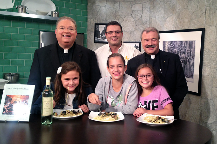 Monsignor Jim Vlaun, Rudy Gambino, Father Michael Vetrano and friends at La Parmigiana in Southampton